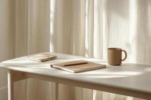 A serene workspace featuring a warm cup and neatly arranged notebooks in natural light photo