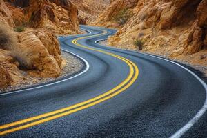 Curving mountain road winding through rocky terrain under cloudy sky during early morning photo