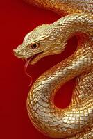 Golden serpent sculpture coiling around a red background with intricate patterns photo