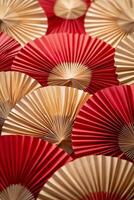 Decorative fans in red and gold arranged in a beautiful display for a festive event photo