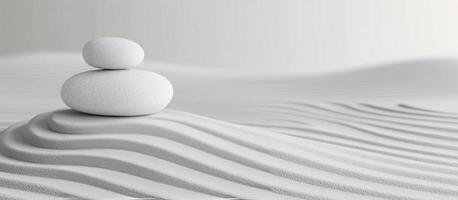 Stones balanced on a serene sand landscape evoking tranquility and mindfulness photo