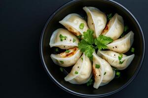 Dumplings arranged neatly against a dark background showcasing culinary artistry and texture photo
