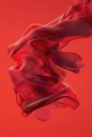Flowing red fabric against a warm orange background creates a dynamic visual experience photo