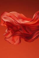 Flowing red fabric against a warm orange background creates a dynamic visual experience photo