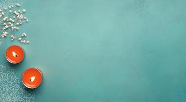Candles and flowers on a turquoise surface creating a serene atmosphere for relaxation photo
