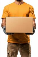 Delivery person in black attire holds a cardboard box against a plain background photo