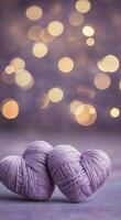 Purple yarn balls create a charming display against a soft bokeh background in evening light photo