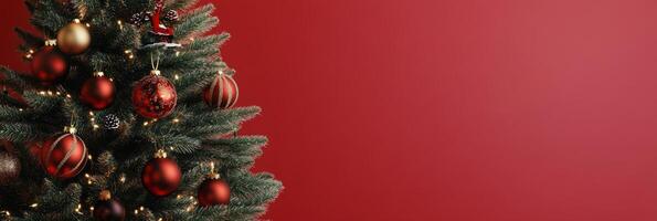 Festively decorated Christmas tree in a cozy indoor setting with a vibrant red backdrop photo