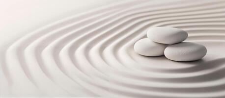 Stones balanced on a serene sand landscape evoking tranquility and mindfulness photo