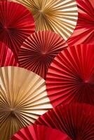 Decorative fans in red and gold arranged in a beautiful display for a festive event photo