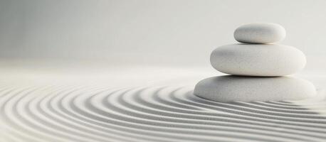 Stones balanced on a serene sand landscape evoking tranquility and mindfulness photo