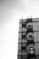 A tall building with fire escape stairs on it photo