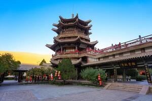 Dunhuang,China-OCT 21, 2024- Crescent Lake, called as Yueyaquan, is a crescent shaped lake in the oasis, located in Dunhuang city, China photo
