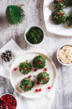 Fish salad in dill on crackers in the shape of Christmas trees on a plate top and vertical view photo