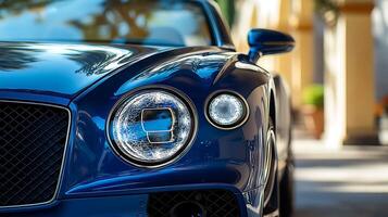 Detailed front view of a high-performance car headlight illuminating the road ahead photo
