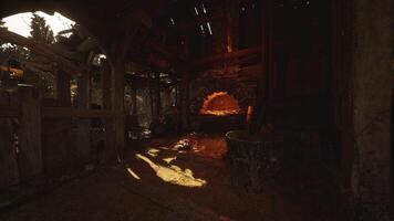 A rustic forge illuminated by warm light within an old workshop photo