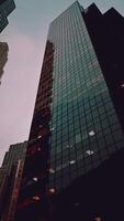 Looking Up at a Tall Building With Many Windows photo
