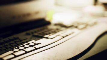 A close up view of a keyboard on a desk with soft ambient lighting photo