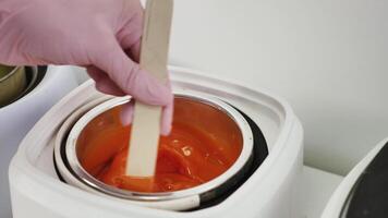 A person is using a spoon to stir orange juice video