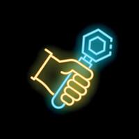 Gloved hand holding socket wrench neon sign on black background vector