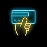 Neon sign of a hand holding a credit card on black background vector