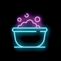 Neon sign of sudsy water in a basin representing a spa treatment vector