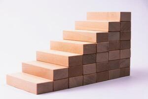 Wooden cubes stacked to form steps of a staircase. background photo