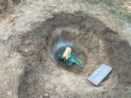 Construction team digging a fresh water well photo