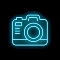 Neon camera icon glowing on black background vector