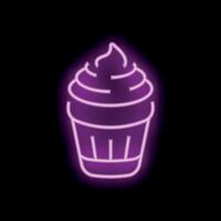 Neon sign showing a delicious cupcake with icing on black background vector