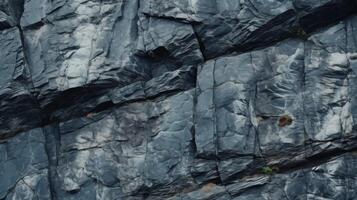 Dark aged shabby cliff face and divided by huge cracks and layers. Neural network photo
