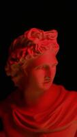 A statue of a man with red light on it video