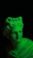 A statue of a woman in green light video