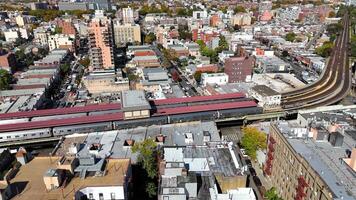 Aerial View of Train Tracks in City Brighton Beach. Aerial shot of train tracks Brighton Beach Cityscape curving through a busy urban neighborhood video