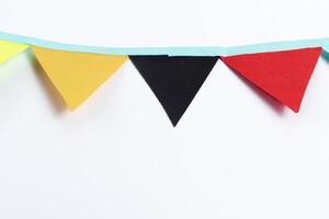Colorful paper garland on a white background with space for text photo