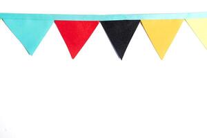 Colorful paper bunting flags on white background with copy space. Perfect for parties and celebrations photo