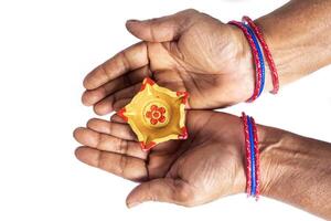 Hands with Colorful Bangles Holding Diwali Oil Lamps for Festive Decor photo