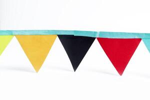Colorful triangular bunting flags isolated on white background with clipping path photo