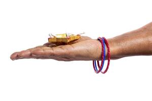 Indian woman holding Diwali oil lamp in palm with colorful bangles on white background. photo