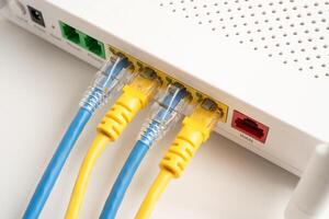 Ethernet cable with wireless router connect to internet service provider internet network. photo