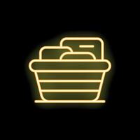 Neon laundry basket full of clothes icon on black background vector