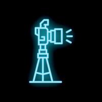 Neon camera icon flashing on tripod in dark background vector