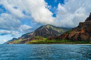 The Napali Coast of Kauai, Hawaii as viewed from a boat on the Pacific Ocean. photo