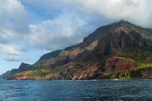 The Napali Coast of Kauai, Hawaii as viewed from a boat on the Pacific Ocean. photo
