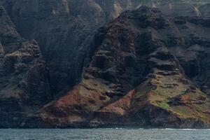 The Napali Coast of Kauai, Hawaii as viewed from a boat on the Pacific Ocean. photo