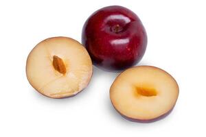 resh red plums fruit with slice on white background. photo