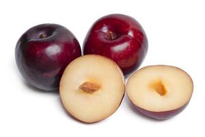 Fresh red plums fruit with slice on white background. photo