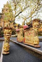 Golden Musical instrument in Ancient Pagoda of Portal von Taman Saraswati temple in Ubud city landmark on Bali Island of Indonesia. Travel destination for culture of Asian photo