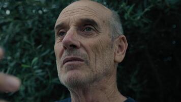 Smiling Elderly Man Makes a Call With His Children Near a Tree in Nature video