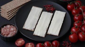 Rectangular whole grain crisp bread with cream cheese for a hearty, nutritious breakfast video